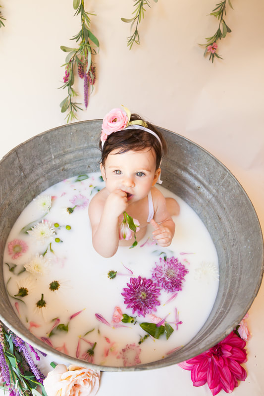 baby girl in milk bath 