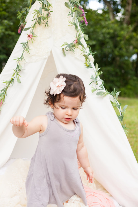 Baby girl walks away from white tent in Tampa FL