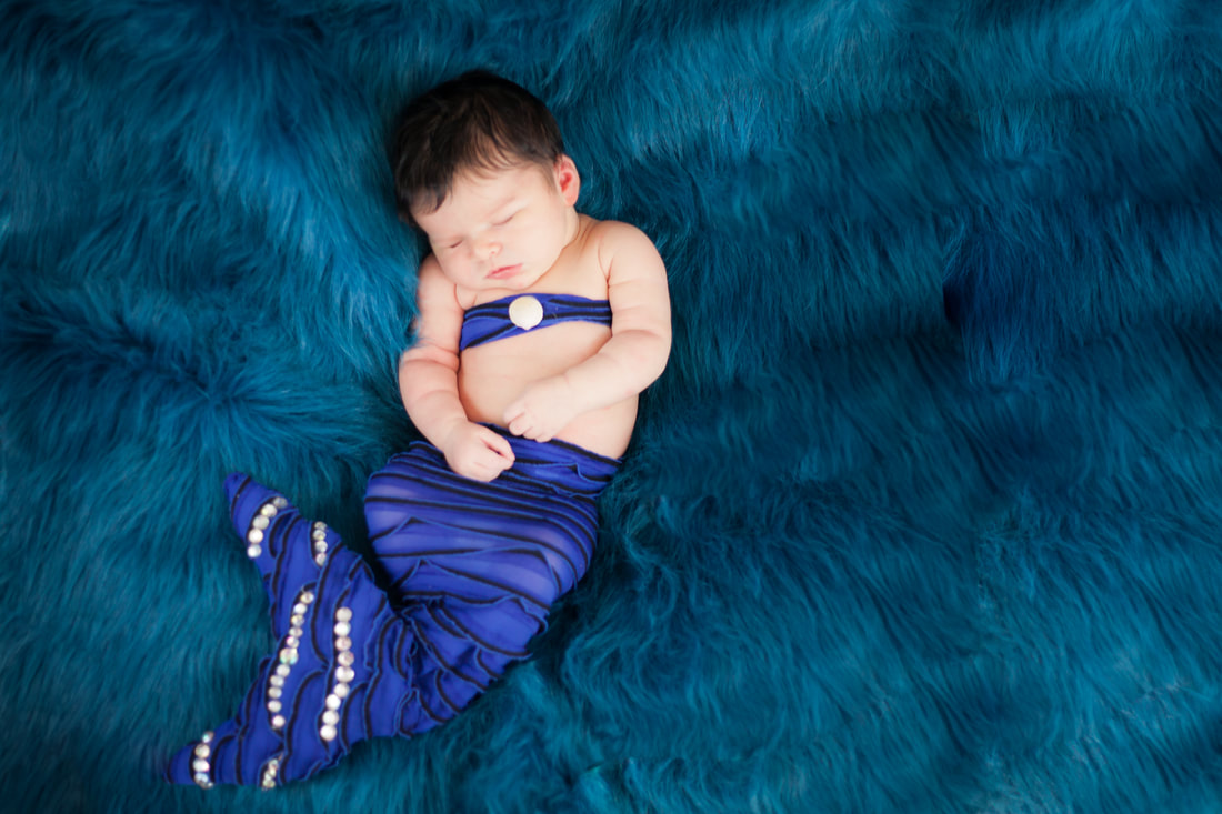 Newborn baby girl dressed as mermaid in Odessa Fl