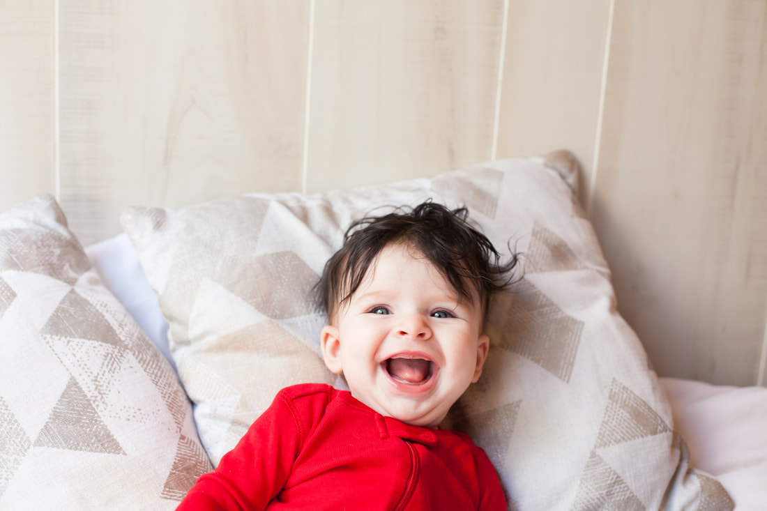 Laughing baby in Red pajamas Tampa FL