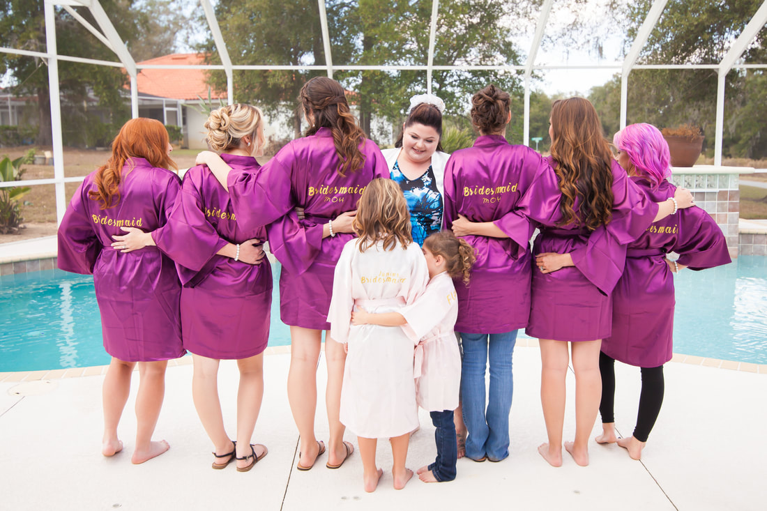 Bride with her bridesmaids in robes in Inverness FL