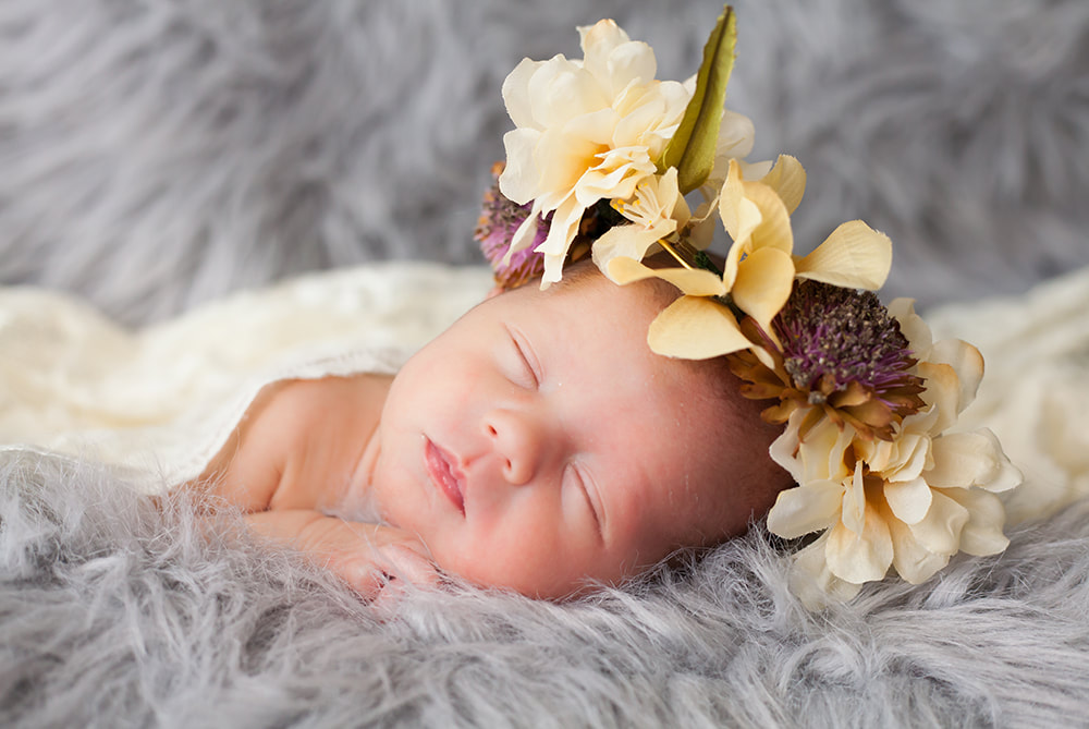 sleeping baby wearing flower crown photo taken in Wesley Chapel FL